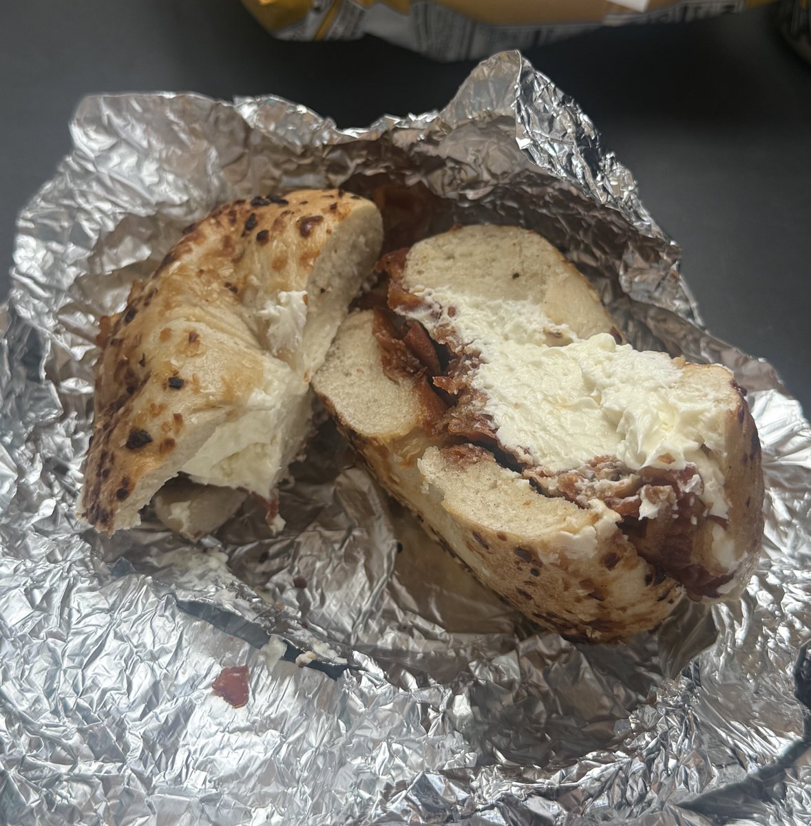 askedaddle's tweet photo. the bagel if anyone cares Btw… onion bagel w cream cheese and bacon Btw… #bagellover #ilovebagel #bust https://t.co/tkmIPgCVQ1