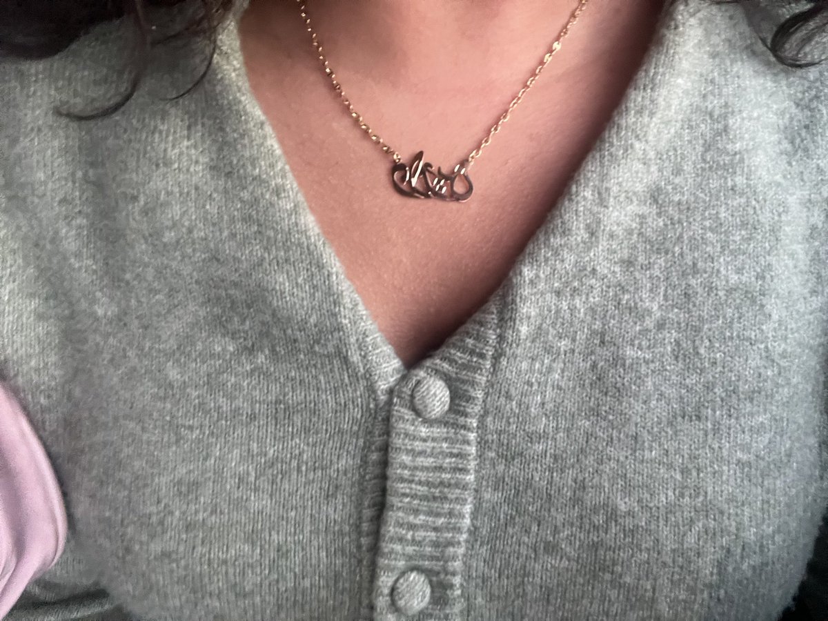 My gold necklace, It has my name in Arabic Darine دارين