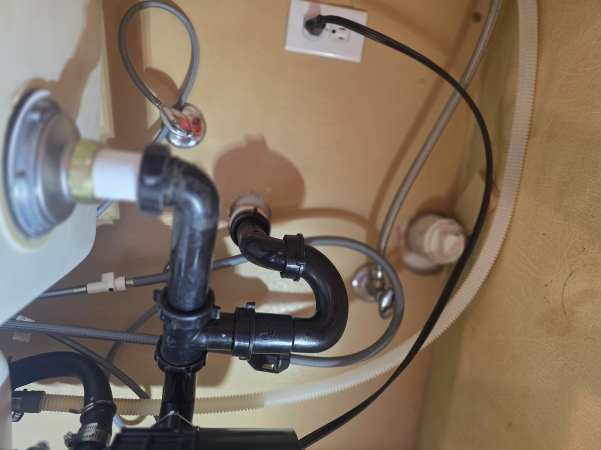 jr91668's tweet photo. We visited a customer experiencing leaks in the cabinet due to a rotted basket strainer and faulty drain assembly. Replaced these with a new Kohler strainer and tubular drains. #PlumbingFix #LeakFree https://t.co/4CMHKNbsGQ