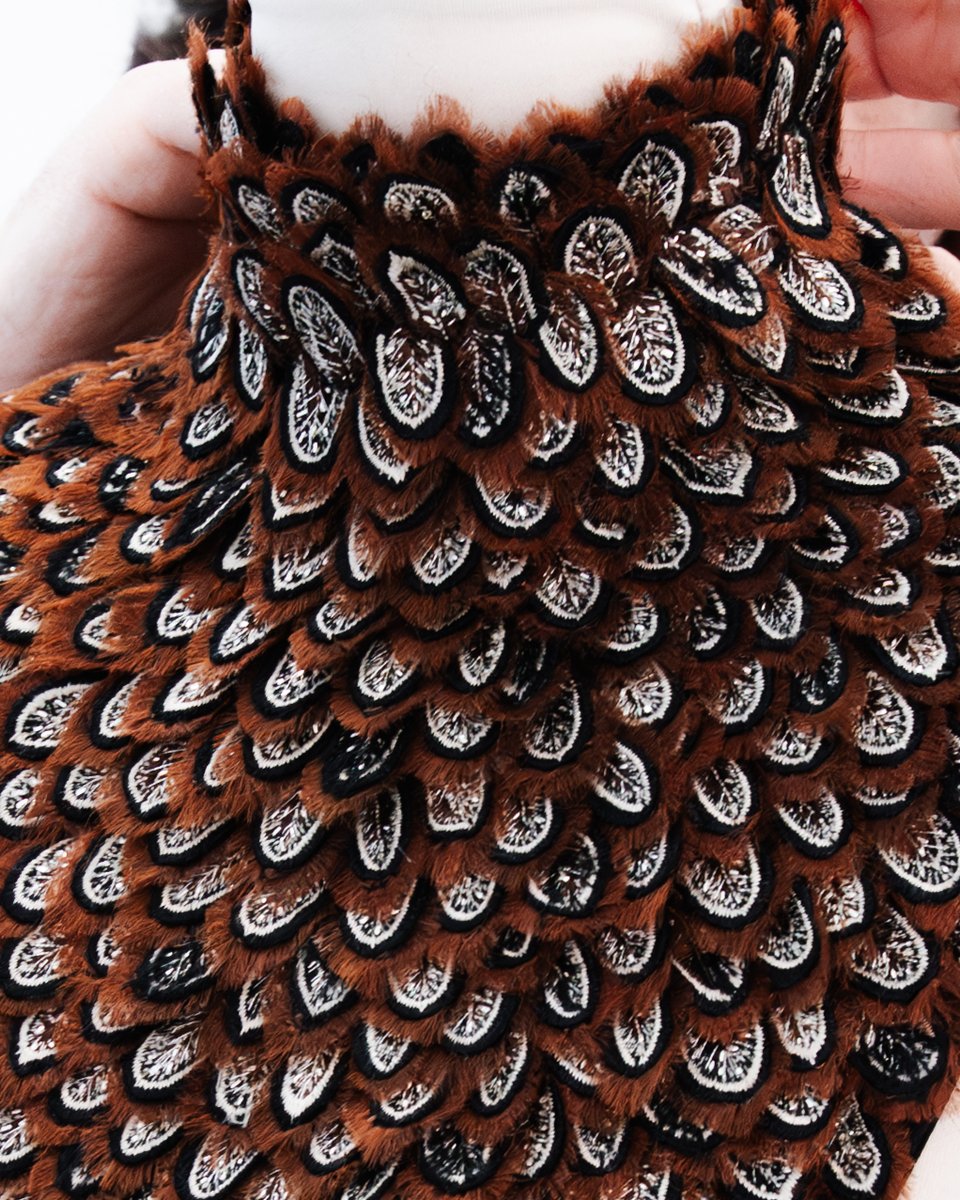 McQueen's tweet photo. McQueen Autumn Winter 2026 

Tactile artistry. Intricate layered feather embroideries in frayed organza, satin stitch and bullion. https://t.co/TJI8NRnv41