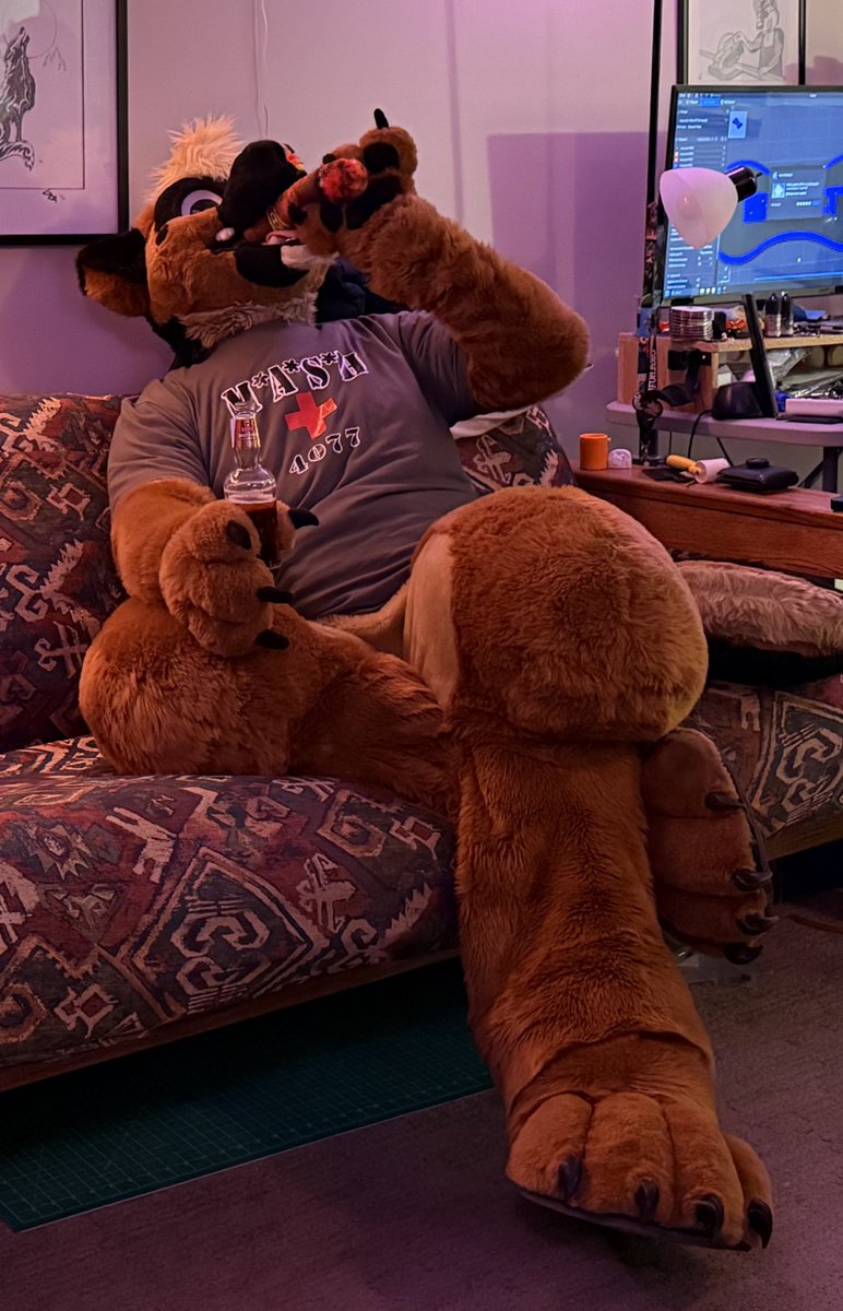 Enjoying a puff on the plushie stogie and having a beer this #fursuitfriday