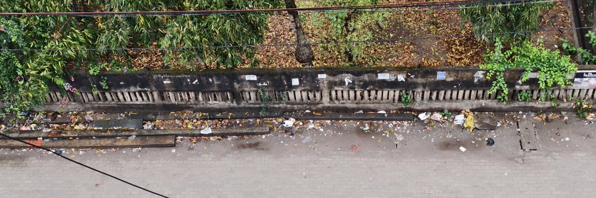DevRoye's tweet photo. A little shower last night and you find the streets flooded with rain water. There are no escape route for run off to the drains, beyond any explanation! See the debris in front of the Bodoland house in Ajanta Path, Survey, Beltola! 
Will you please do something @guwahati_gmc https://t.co/k7nzOsHLCD