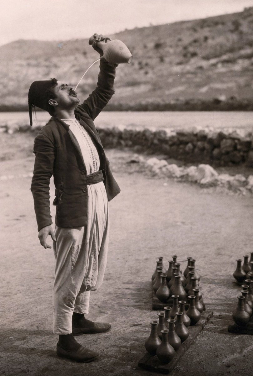 🇱🇧 A man drinking water on the Beirut-Saida road, Lebanon, 1926.