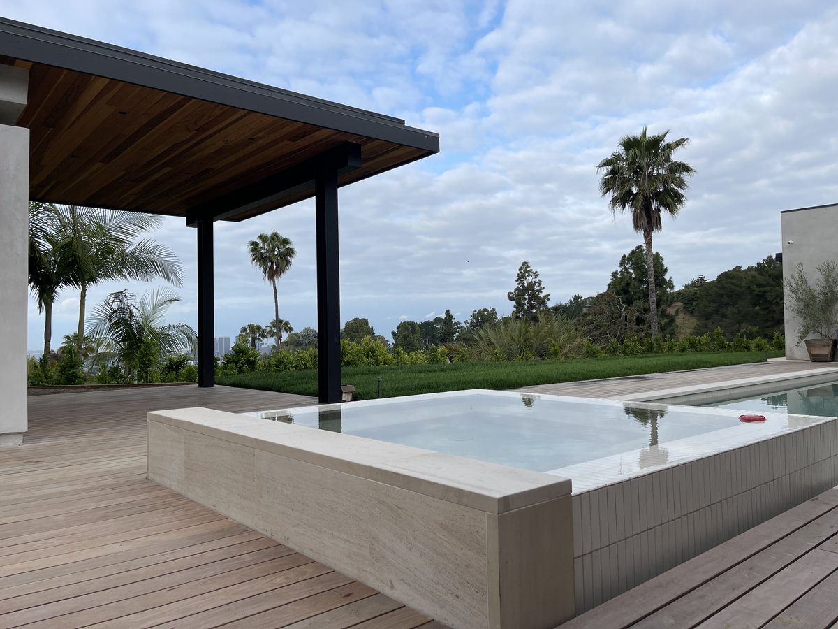 A raised spa with a spillway on all three sides instantly turns your backyard into a luxury retreat. Water gently flowing from every edge creates beautiful movement, soothing sound, and a stunning centerpiece for your pool design. Relax, unwind, and enjoy the view 💧✨