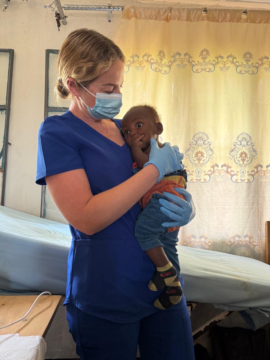 TeamHeartRwanda's tweet photo. Gaining the trust of the most curious of the youngest sets the stage for a great cardiac echo screen--and a happy  Mom watching!  Thank you Ashley Murdock for illustrating the human touch side during this two week echo screening camp in @NyagatareDistr - Thank you to @RwandaRbc @GatundaH @NyagatareHospit  for your wonderful collaboration