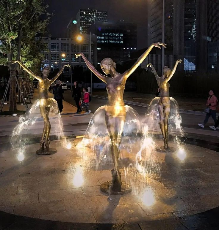 The famous "Ballerina Fountains" created by Polish sculptor Malgorzata Chodakowska.