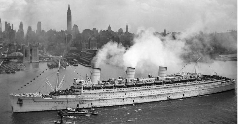 amyanderberg's tweet photo. On March 21, 1940, The Queen Mary set sail from New York to Sydney for her first voyage as a troopship. Coated in grey paint, The Grey Ghost transported 15,000 troops and was able to evade a $250,000 bounty set by Hitler. 
Left: The Grey Ghost (1940)
Right: The Queen Mary (2026) https://t.co/6EzO1MeHRu