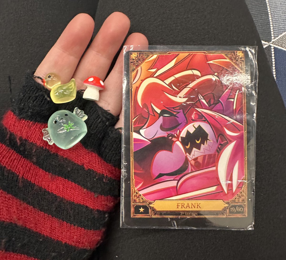 i got gifted some lovely little trinkets from a few hazbin hotel fans which was super sweet 🥺🥺 i could cry you all are soo nice. sobs