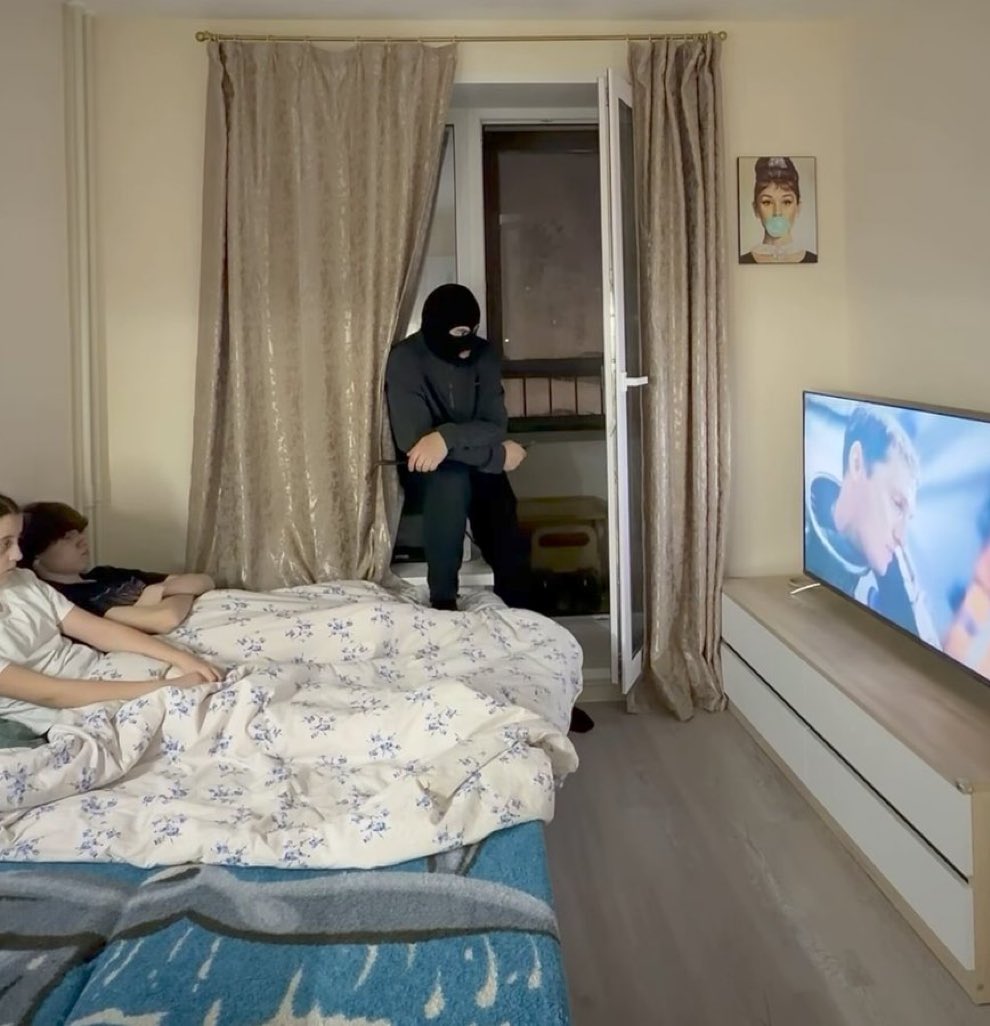 When the robber finds you watching an Arsenal game