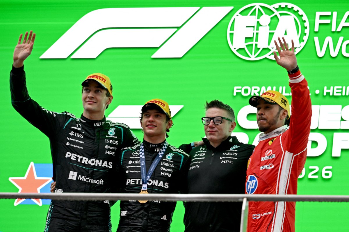 Kimi Antonelli, George Russell, Lewis Hamilton &amp; Bono all on the podium.

This is like the Mercedes version of the Avengers.