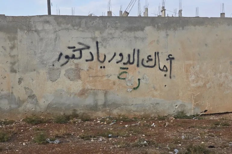 EngBayann's tweet photo. Dear Ann, please get the facts corrected. This is a region where history matters deeply, and how it is recorded can later lead either to peace or to blood.

Children in Daraa went out in February with the slogan “It’s your turn, Doctor.” They were arrested, and this became the first spark that made the city rise entirely. 

The people of Daraa then faced arrests, killings, siege, and shelling. From that moment, other Syrian cities began to come out in solidarity with Daraa, chanting: “Daraa, we stand with you until death.” 

The government later recognised 18 March as the date of the first martyr in Daraa, the actual moment that ignited the uprising across the country. 

https://t.co/t1ALNePYfJأجاك-الدور-يا-دكتور-الجزيرة-نت-ترافق