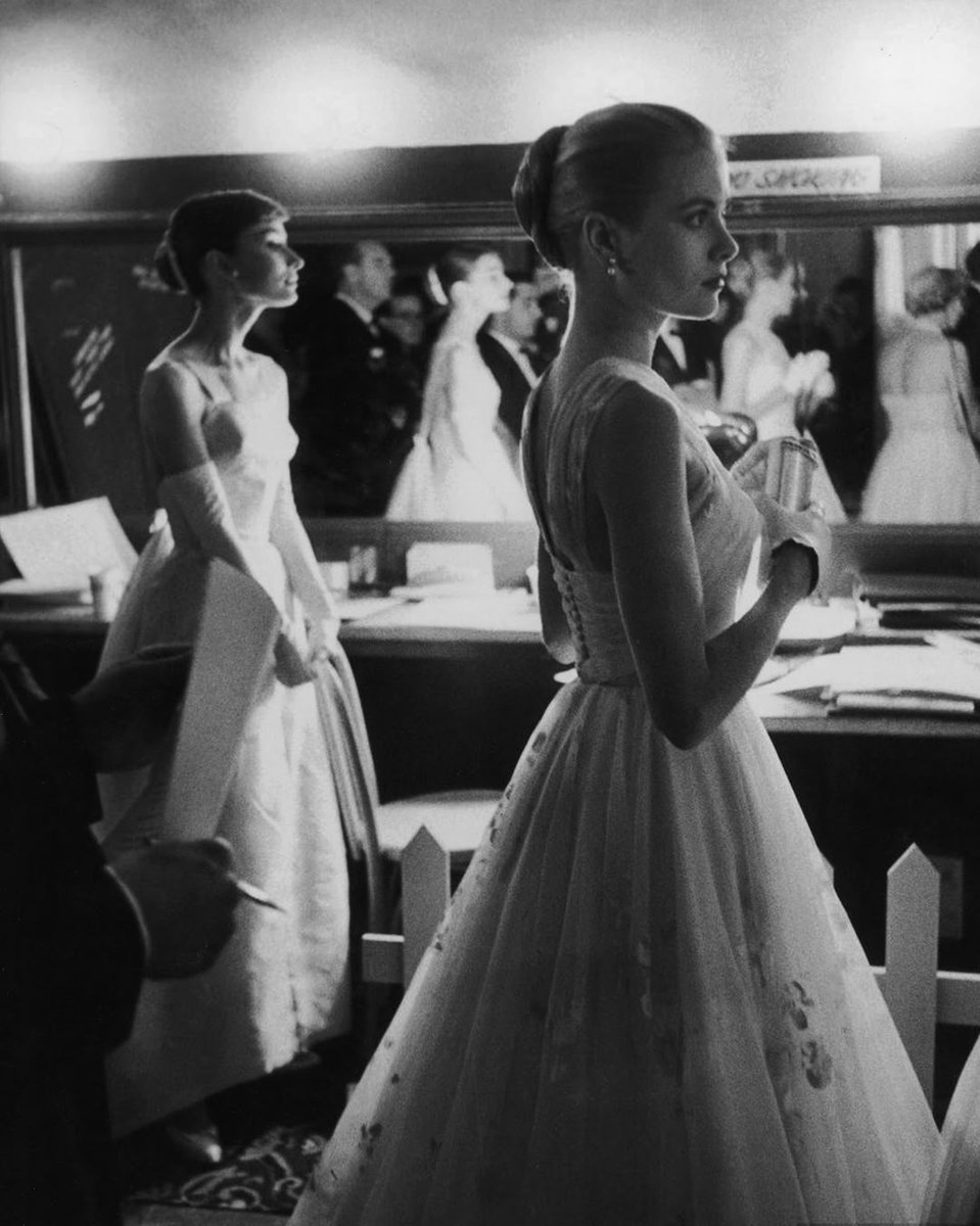 A reminder of real Academy Award class and glamour from 70-years ago. Audrey Hepburn and Grace Kelly backstage at the 28th Academy Awards in 1956.