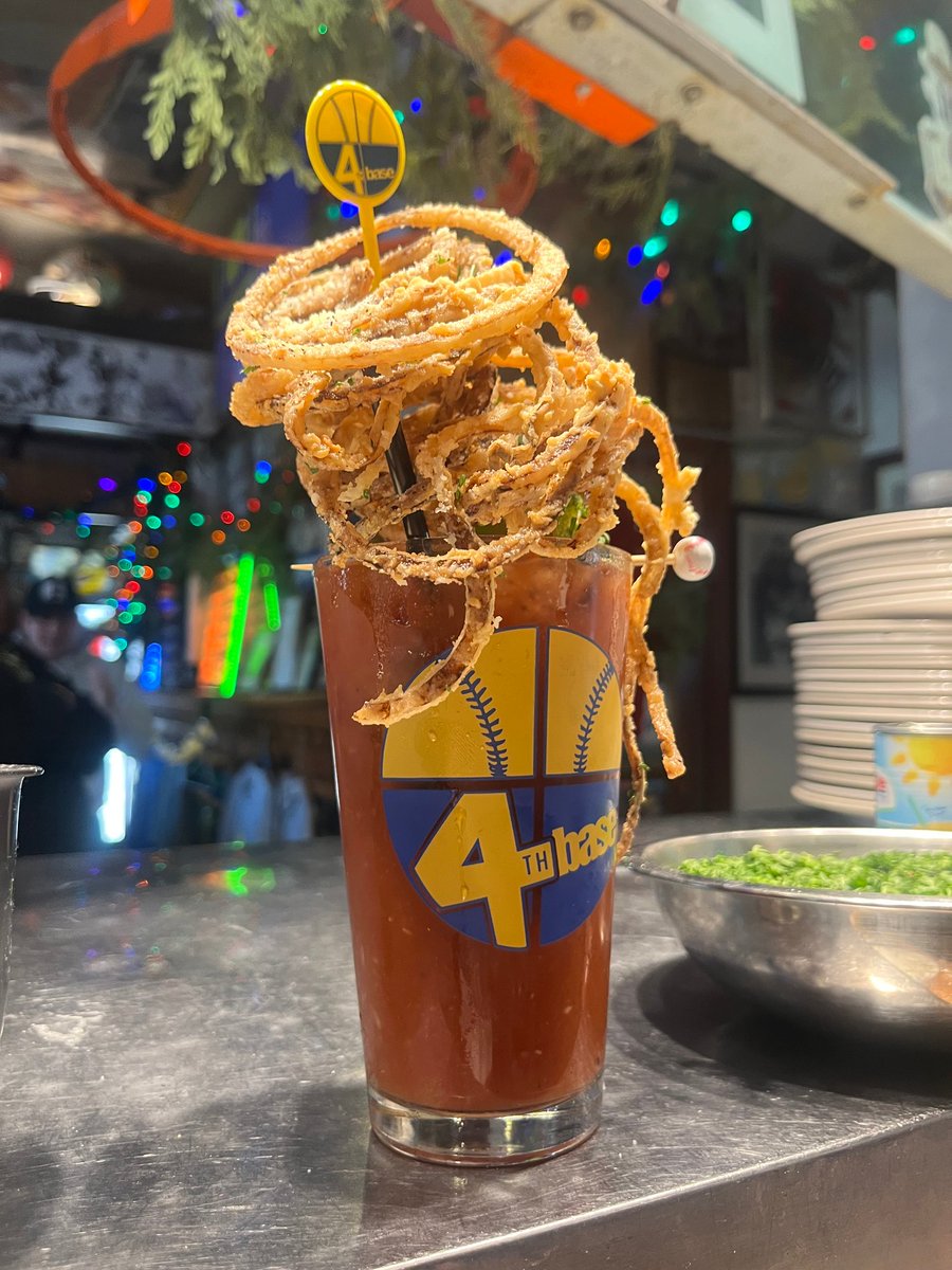 4thBase1's tweet image. Kickstart your weekend vibes with our bestseller! 🍹🎉 Dive into the robust flavors of our handcrafted Bloody Marys! Garnished with a crunchy vegetable skewer, a heap of haystack onion rings, and chased by a 16oz beer. 🍺 #4thBaseRestaurant #BloodyMarys #WeekendVibes