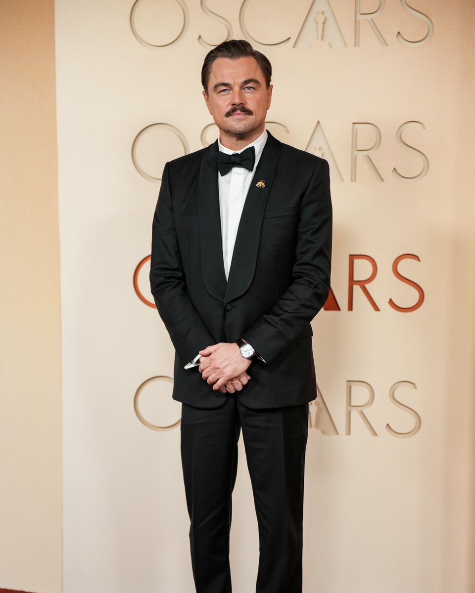 enews's tweet photo. One carpet after another, Leonardo DiCaprio knows how to walk the #Oscars. 😎 (📸: Shutterstock) https://t.co/YBAj4tx8nS