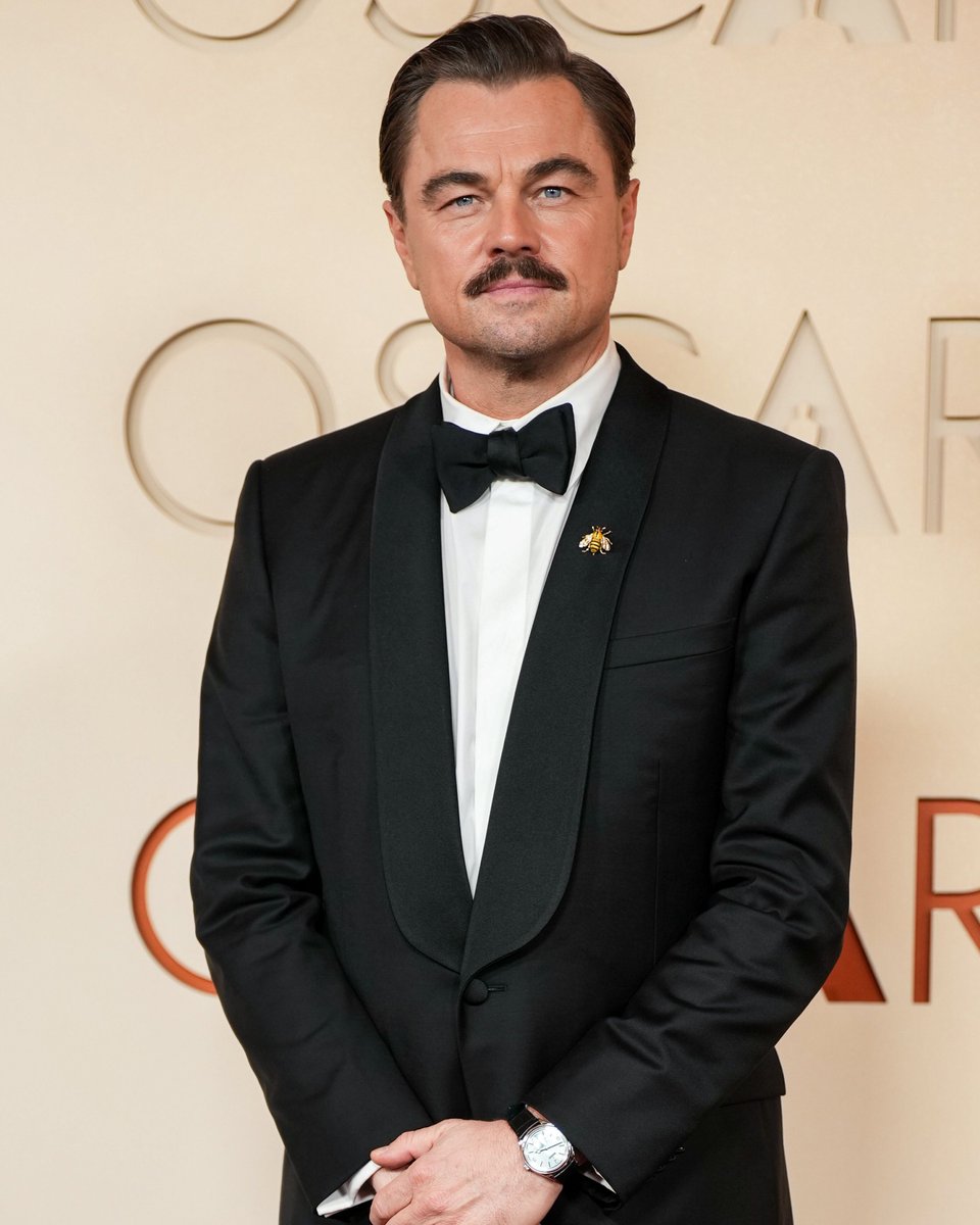 enews's tweet photo. One carpet after another, Leonardo DiCaprio knows how to walk the #Oscars. 😎 (📸: Shutterstock) https://t.co/YBAj4tx8nS