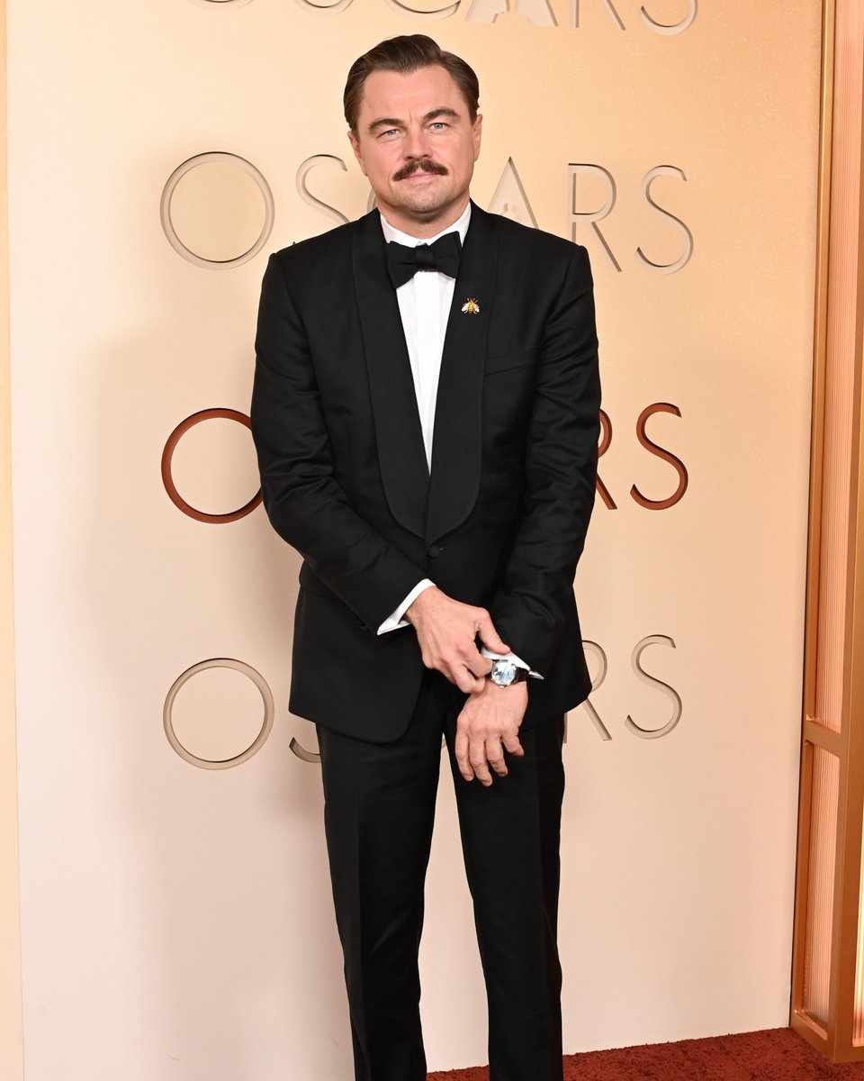 enews's tweet photo. One carpet after another, Leonardo DiCaprio knows how to walk the #Oscars. 😎 (📸: Shutterstock) https://t.co/YBAj4tx8nS