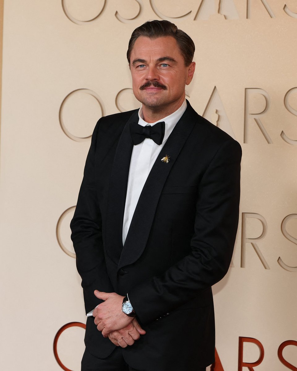 enews's tweet photo. One carpet after another, Leonardo DiCaprio knows how to walk the #Oscars. 😎 (📸: Shutterstock) https://t.co/YBAj4tx8nS