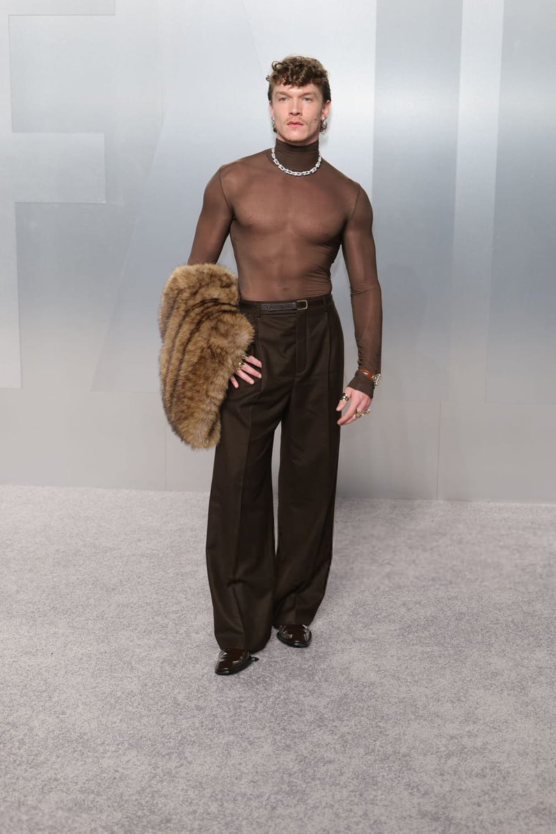 Connor Storrie looks like a modern prince, turning the Vanity Fair Oscar Party into his royal court.