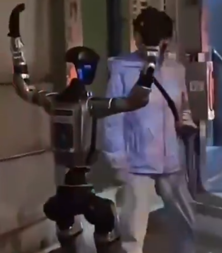 Dexerto's tweet photo. A humanoid robot was escorted away by police after scaring a 70-year-old woman on the street in Macau https://t.co/D7ygSrxKGn