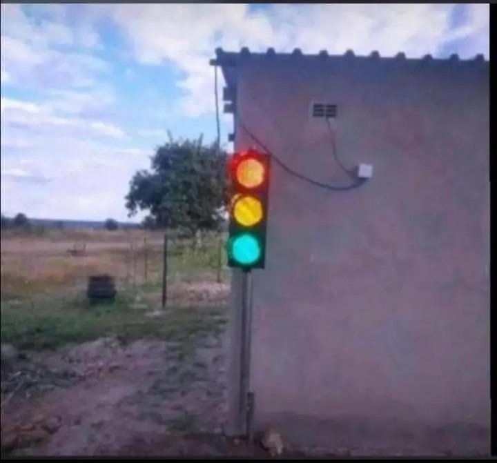 Red = I'm not at home 
Orange= I'm on my way back 
Green= I'm home.