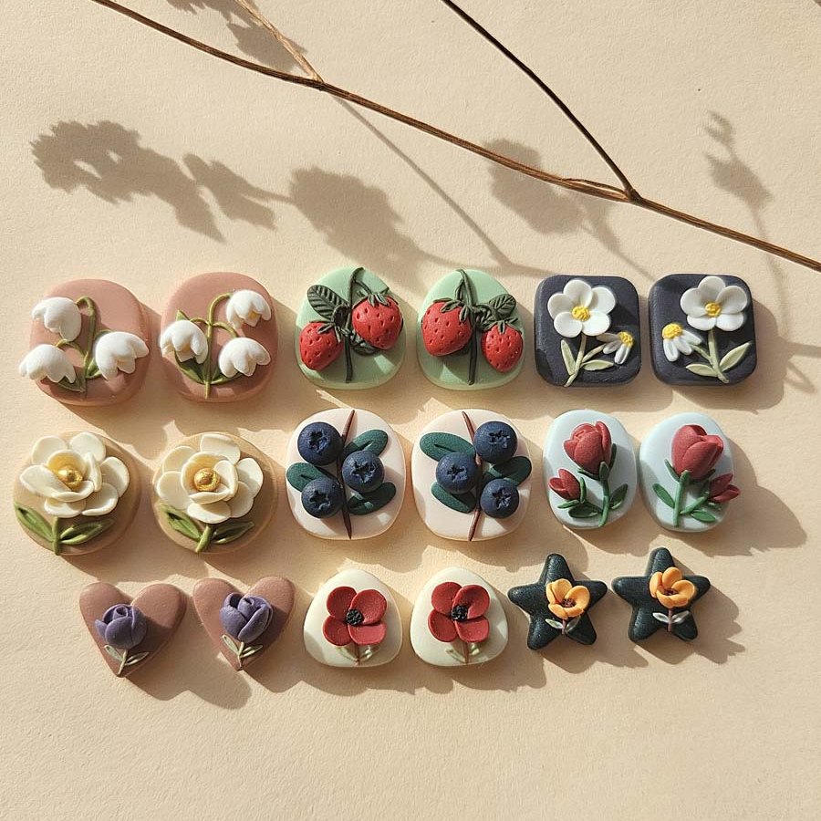 NoomCottageClay's tweet photo. My 9 new pairs of flower &amp; fruit polymer clay stud earrings I made. https://t.co/IuQLIIppYQ