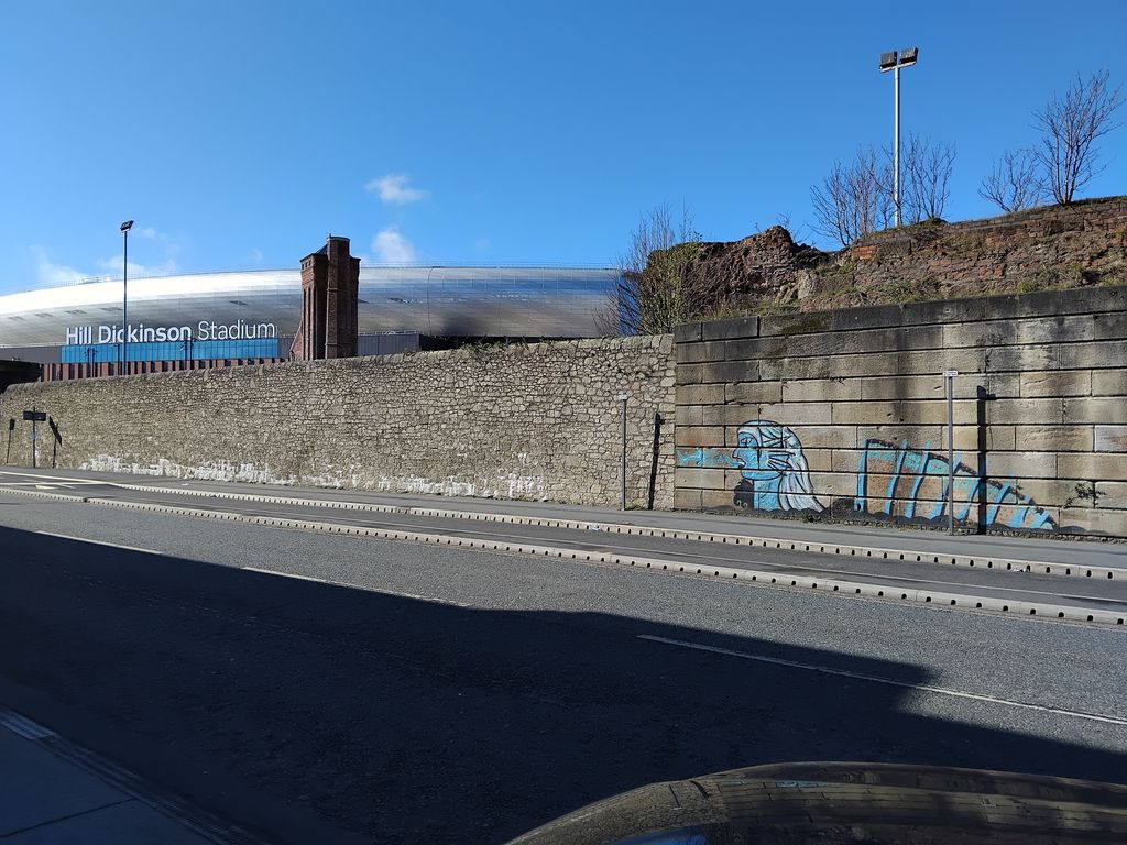 LittleAlis71829's tweet photo. GRAFFITI on the dock wall by the new Hill Dickenson Stadium. I would have said this is some kind of Neptune like God, symbolising footballing glory from the dockside for Everton Football club.
👉 https://t.co/F6PTF1YxOj 
#Graffiti    #StreetArt    #LiverpoolLoopLine https://t.co/bCDXZ0xhKD