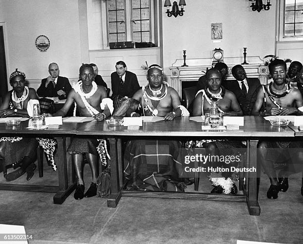 Delegates from Swaziland attend a conference in London to discuss the future of the British Colony. L-R: J.M.B. Sukati, Nhlabatsi, S.T.M. Sukati, P.L. Dlamini, and A.K. Hope. (Photo by © Hulton-Deutsch Collection/CORBIS/Corbis via Getty Images). January 1963.