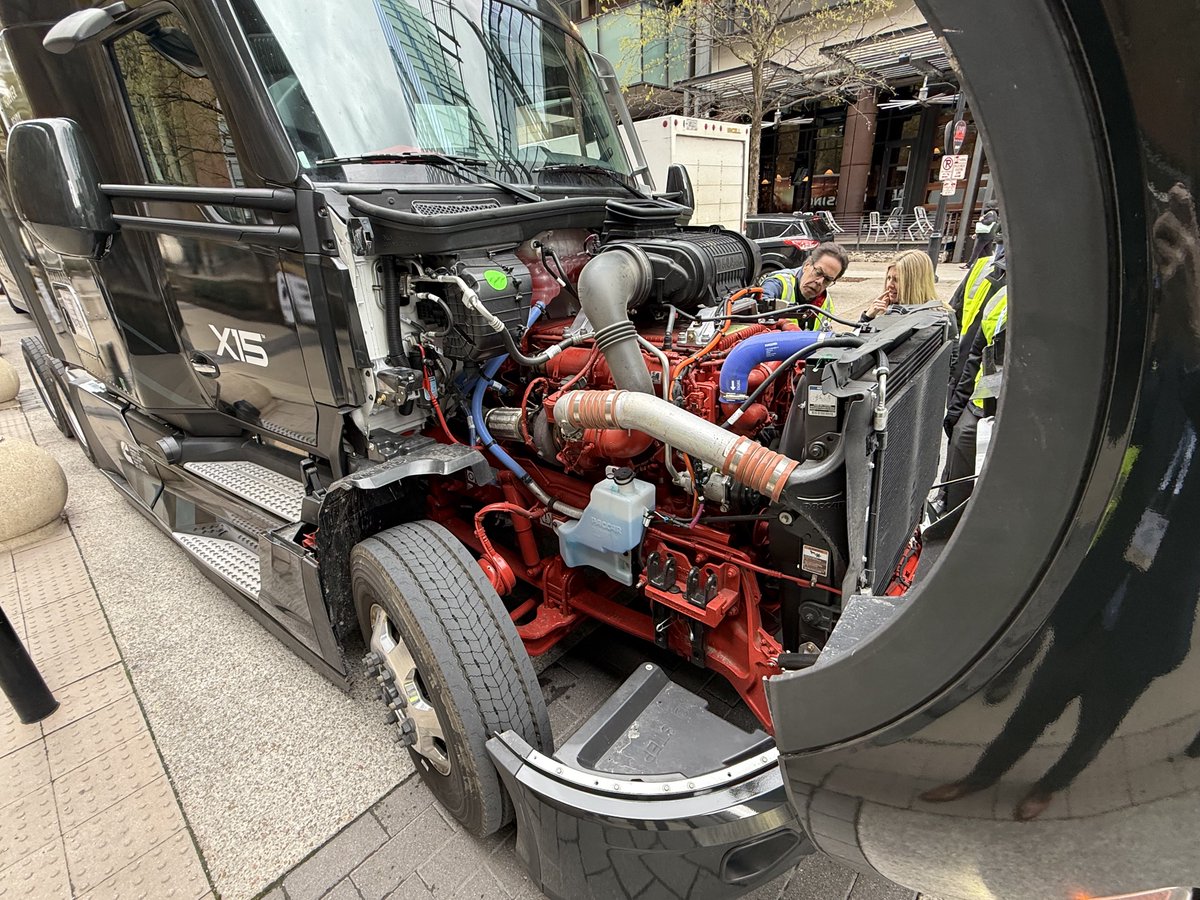 SethClevenger's tweet photo. Cool opportunity to step inside the cab of a Tesla Semi or check out the 2027 Cummins X15 engine right outside the convention center at #TMC26 https://t.co/Prajb4IsLN