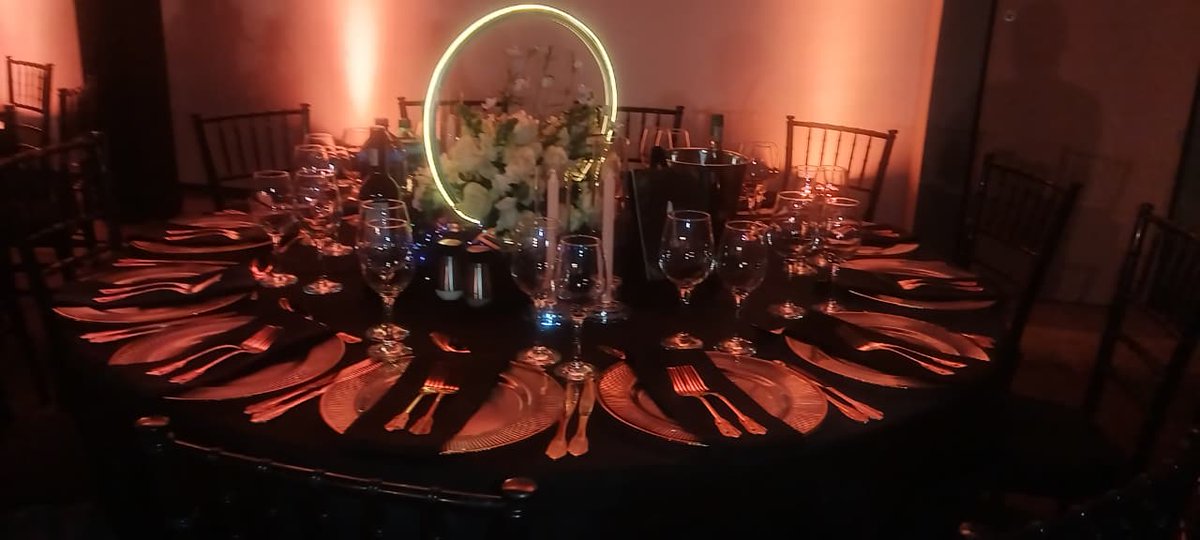 DithakgaD's tweet photo. Celebrating two decades of outstanding achievement, Gems' elegant gathering for 450 distinguished guests embodied excellence, with a sophisticated black and gold color scheme that set the tone for a truly unforgettable experience. The tables showcased stunning LED neon ring centerpieces, adorned with vibrant florals and complemented by candle holders that radiated warmth and sophistication. A grand welcome entrance and photo booth setup with a sleek black backdrop and gold balloons further elevated the sense of occasion.

 Bringing this vision to life was Dithakga Weddings and Events Decor, whose meticulous attention to detail and expert craftsmanship delivered an extraordinary celebration that left a lasting impression.

#20yearsGems
#decor
#FocusRooms 
#eleganteventandweddingplanners
#dithakgaweddingsandeventsdecor