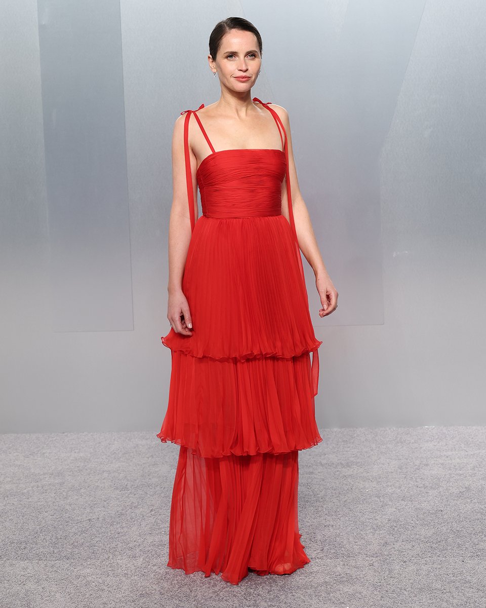 sachin and babi light blue dress FelicityJones wore Valentino at the Vanity Fair Oscars Party. She was seen  in a #ValentinoPreFall2026 red chiffon plissé dress featuring a bustier  bodice and pleated volants. #VFOscars