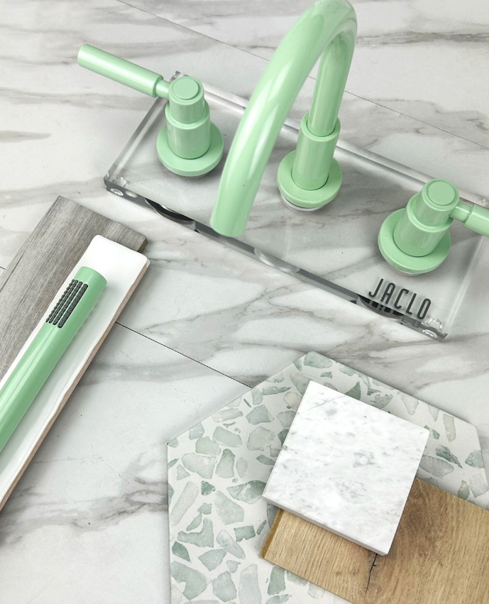 We're feeling lucky this St. Patrick’s Day! 🍀 We’re surrounded by stunning design inspiration every day, like <a href="/jacloindustries/">JACLO | Decorative Plumbing Fixtures</a> Uptown Contempo Faucet and Slim Rain Handshower in Mint Green. 💚 #StPaddysDayPlumbing #MosaicHomeInteriors