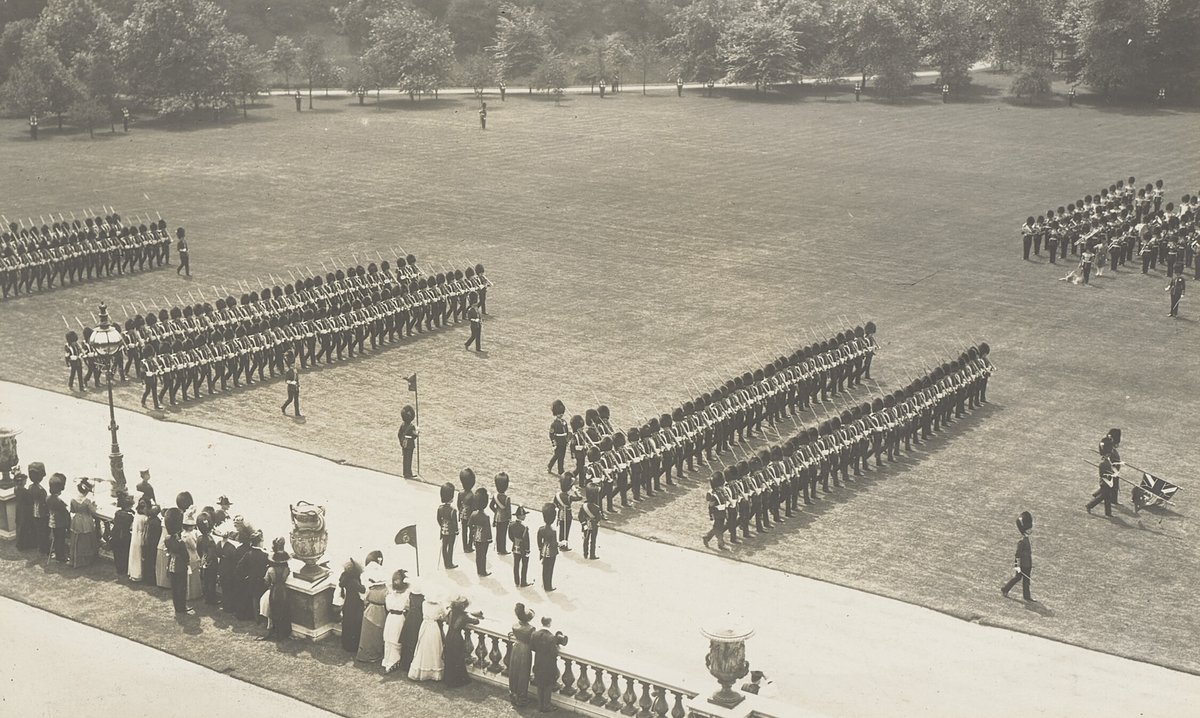 The Irish Guards march past King George V after being presented with new Colours at Buckingham Palace in 1913. (Royal Collection Trust)