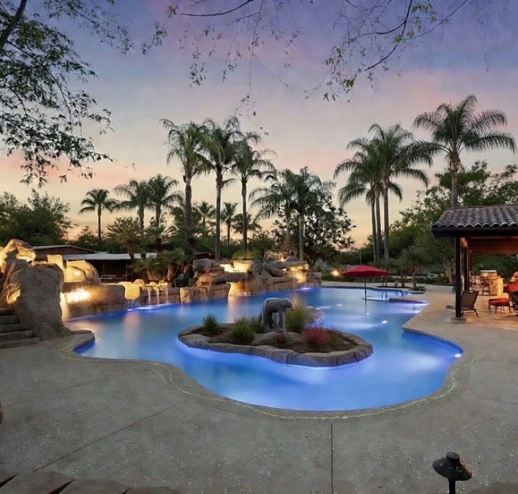Escape to paradise in the heart of California! 🌴✨ Handcrafted luxury meets natural wonder at this stunning resort-style oasis, featuring crystal-clear swimming pools nestled among breathtaking rock formations.