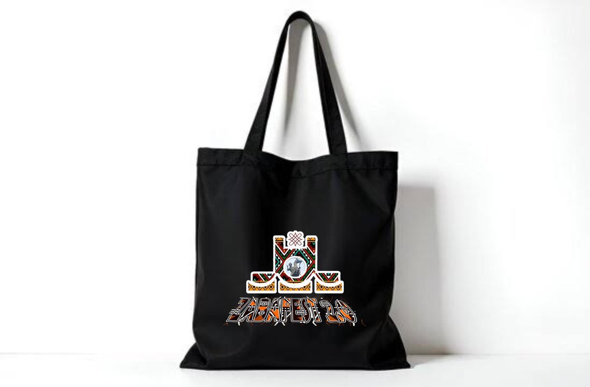 ZABAFEST's tweet photo. The Zazzau Books and Arts Festival 2.0 tote bag is here — featuring artwork by Hamood Calligraphy.

Right now, it’s in black: bold, simple, timeless.
But we’re curious–is black perfect, or should we explore another colour?
If yes… which one? 
#ZABAFEST2026 #bookishalchemy23 https://t.co/wAU7o0RtTY