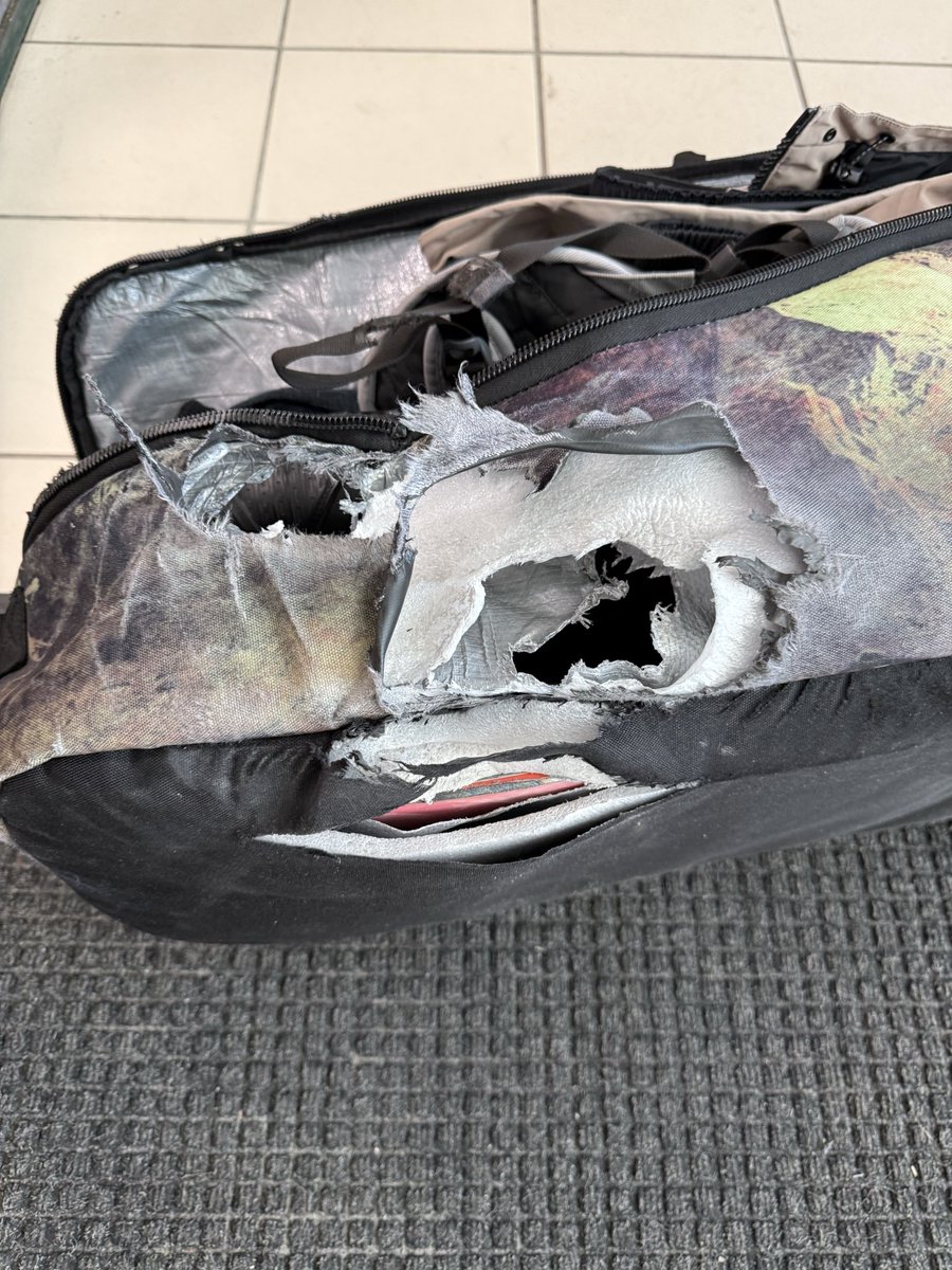 jackcsenge's tweet photo. @BreezeAirways can someone please explain to me how this can even be done to my snowboard bag? Really ruined a family trip https://t.co/IKQHILKbVz
