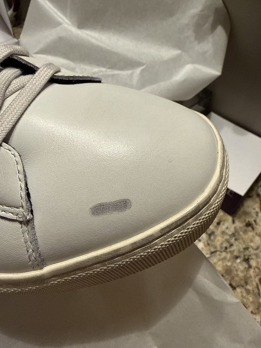 Lisadaft2's tweet photo. @OliverCabell  I waited three mos for these sneakers , they were a Xmas present for my son . I open them just to find silver sharpie marks all over them . Ridiculous! https://t.co/4PYJKwnuC0