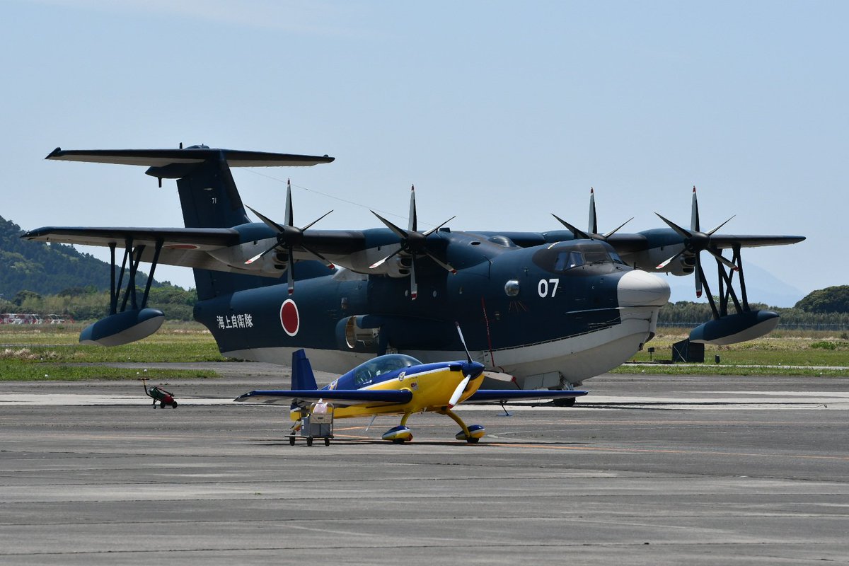 MARCH_D7500's tweet photo. 2025年のエアメモリアル鹿屋
US-2 9907号機とウイスキーパパ エクストラEA-300L JA14WPの並びこちらもまた見て見たい光景です。 https://t.co/d73GbvRIQ3