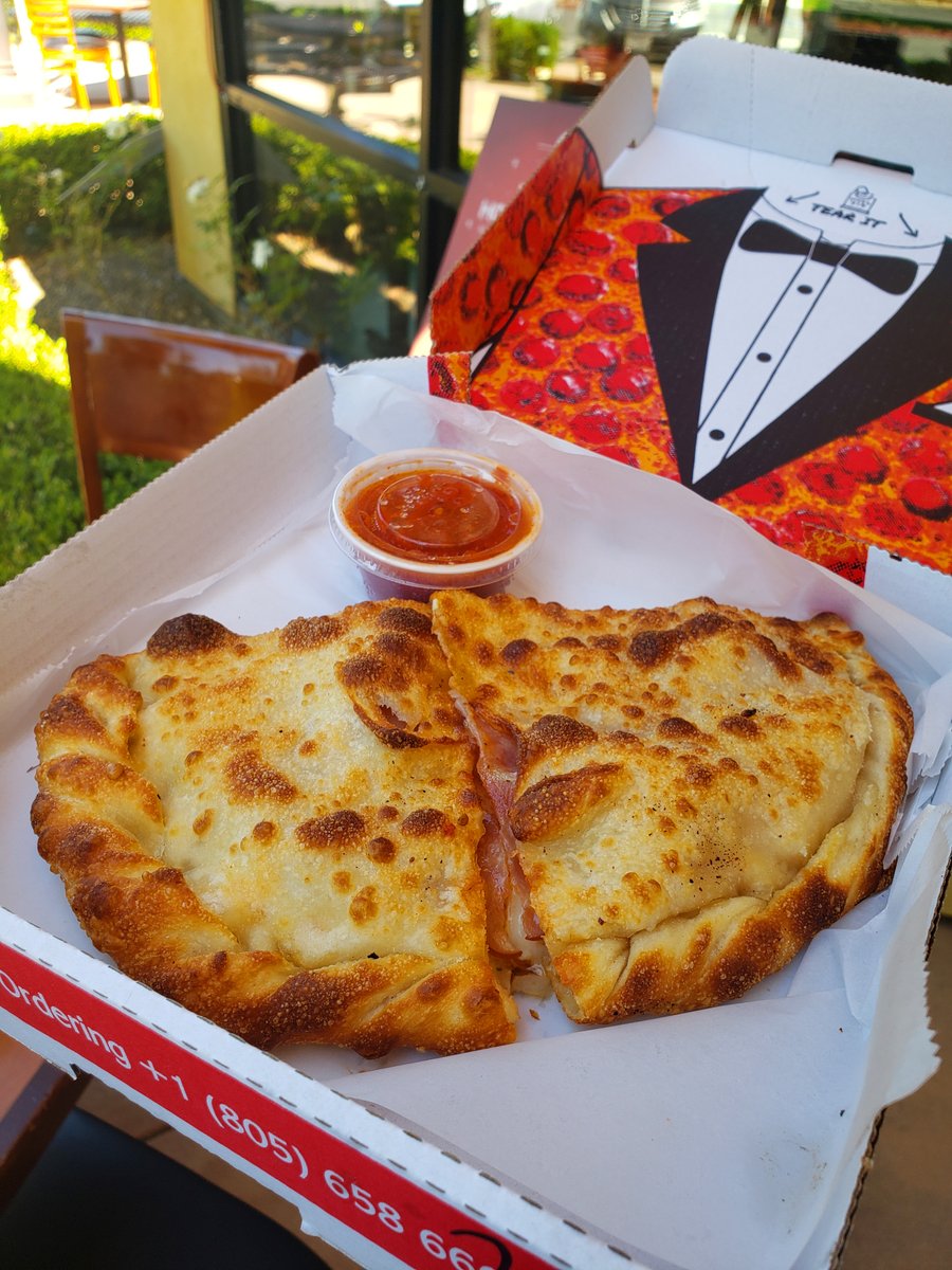 Look at that crust. 😤✨ Perfectly golden, blistered just right, folded around a warm, cheesy, flavor-packed filling — with marinara on the side for dipping. Our calzone doesn't get enough credit and today that changes. 🍕 Order yours at pizzamandans.com #PizzaManDans