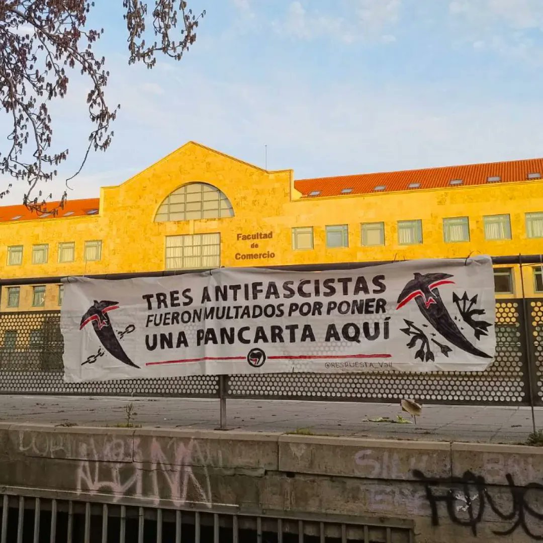 #Spain - Message with a banner from antifascist students at the Universidad de Valladolid who were fined for hanging a banner: 

‘Three antifascists were fined for putting a banner here.’