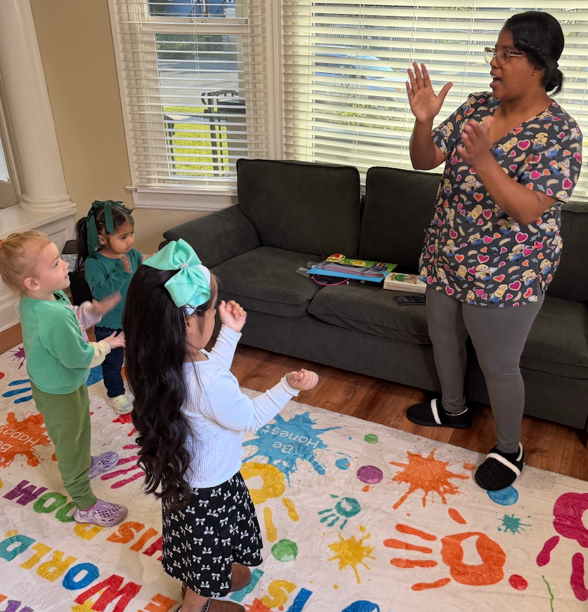 While moms are in chapel, little ones have their own worship time. Teacher Tenisha loves this part of her day.