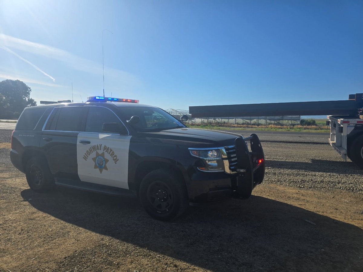 Appears ok, but closer look, this is very dangerous. No flags or warning lights. This metal beam extending 14 ft.   Warning flags are mandatory for extended loads, 49 CFR 393.87. Commercial CHP Officer stopped this tractor for load violation, which prevented a major crash.