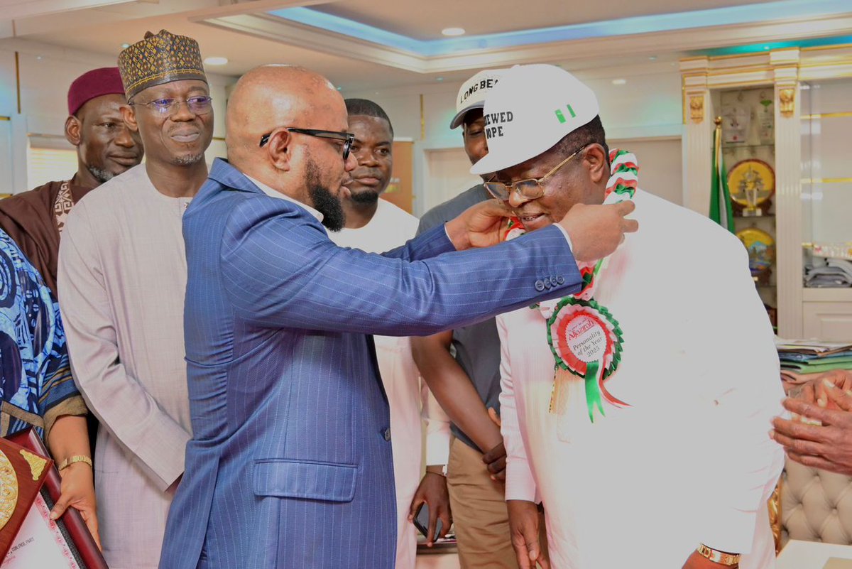 BMB1_Official's tweet photo. UMAHI HONOURED AS INFRASTRUCTURE ICON: BACKED BY VERIFIED RESULTS AND NATIONAL IMPACT

The Minister of Works, Senator Engr. David Umahi, CON, on Wednesday received the 2025 Personality of the Year Award (Infrastructure Transformation Champion) from Al Jazeera Nigeria Newspaper.

A recognition which the organisers say followed months of independent scrutiny, investigations, and verification of projects under the Ministry of Works.

Accepting the award with his full team, including the Permanent Secretary and Directors of the Ministry, Umahi said.
“I am here with my team, including the Permanent Secretary of the Federal Ministry of Works and all the Directors. I am deeply touched by this award,”

According to him, what struck him most was not the accolade itself, but the process behind it.
“What makes this recognition particularly important to me is the process behind it. I understand that you undertook a thorough review of the Ministry’s operations. What stands out is that this was done independently, without my knowledge, and I have only just become aware of it. That, to me, is very moving.”

In a country where public trust is often tested, the Minister seized the moment to make a bold claim, that every project under his watch can withstand scrutiny.

“I want to assure you that what drives us in the Ministry is the fear of God. On every project, the Permanent Secretary, the relevant Directors, and the contractors are all involved, and everything is done transparently. If questioned on any detail, including the cost components of a project, we can clearly account for it. There is nothing we do that we cannot defend.”

That confidence, he revealed, is not mere words. The Minister explained that the Ministry formally invited anti-corruption agencies to scrutinise its work, not just on paper, but on the ground.

“Let me tell you something, we wrote to ICPC to go around and investigate all our projects, not on papers, but to go around and investigate the physical accomplishments of what the President is doing. We also wrote to EFCC. Now, ICPC has concluded their own, and we have given them a space here to check our procurement process. They have started their work.”

At the heart of Umahi’s reforms is a strategic shift, the transition from asphalt to concrete roads. A decision he described as a battle but succesful.
“The transition from asphalt to predominantly concrete roads was not without challenges. It was a battle we fought, but we are not afraid of challenges, especially when we are guided by God and committed to serving the people above all else.”

He argued that the long-term benefits far outweigh the initial resistance.
“Most of the roads we are now constructing are concrete, designed to last up to a hundred years with minimal or no maintenance. This is a long-term investment in the country’s future.”

Beyond engineering, the Minister painted a human picture of infrastructure, describing roads not just as projects, but as lifelines.
“We understand the impact of poor road infrastructure. When a road is cut off, it effectively traps people and limits movement, almost like a form of confinement. This is what the President is determined to change, and significant progress has been made.”

“We are not seeking attention or accolades; our focus is on delivering results that improve the lives of Nigerians.”

He also delivered a message to the media, calling for responsibility in an age of rapid information.

“I also encourage those in the media and public space to be responsible. Verify your facts before amplifying any information. Freedom of expression is important, but we are all accountable for what we say and do. Ultimately, what one sows is what one reaps.”

Earlier, in his opening remarks, the Chief Executive Officer of Al Jazeera Nigeria Newspaper, Bassey Williams, described Umahi as a standout figure in public service after what he called a rigorous and independent selection process.

Thread...