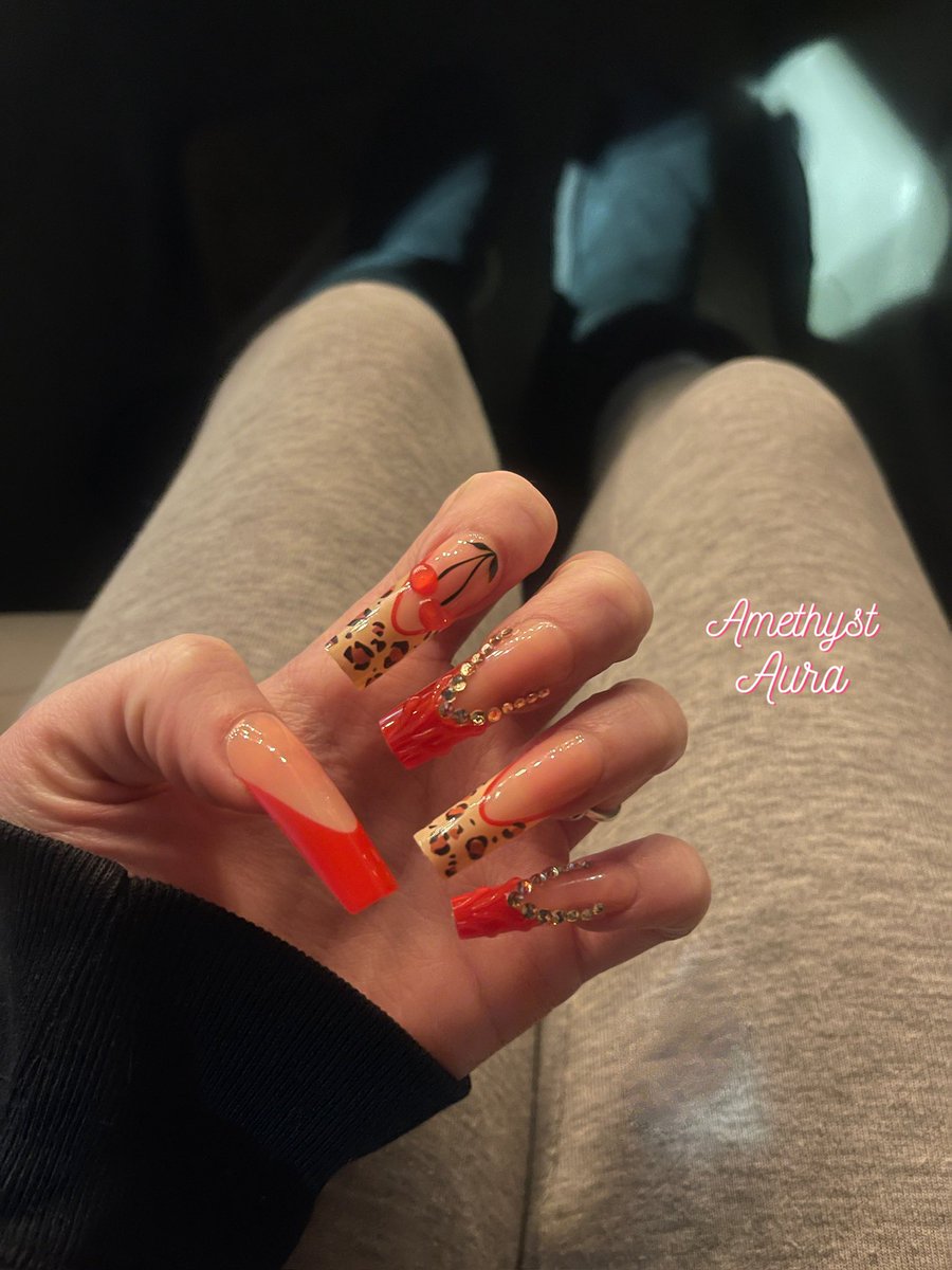 cherry and cheetah nails 🍒