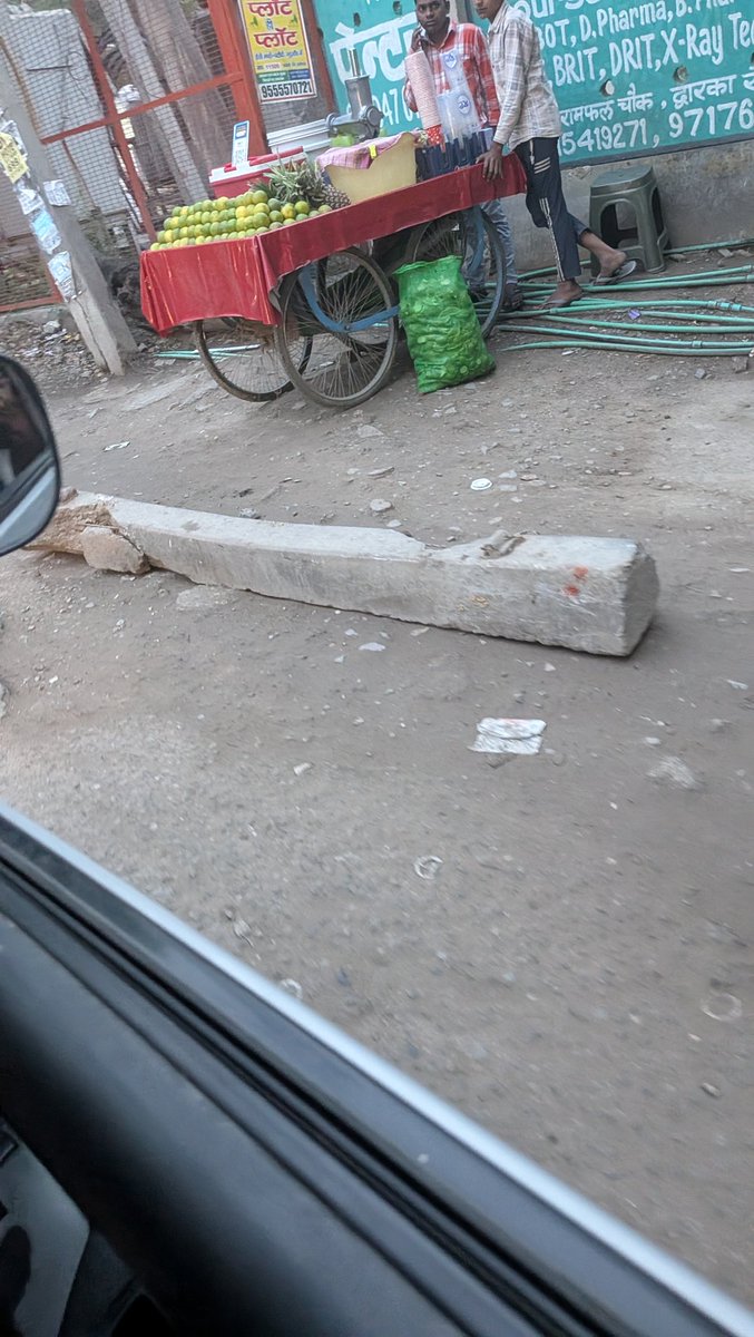 SharmaYuv1's tweet photo. Dear team, 
This concrete pole is lying near the road, it possesses serious hazard for daily vehicle commuters. 

Location: DWARKA SECTOR 8, DADA DEV Mandir road, Bagdola, Opposite of Dharmendra store.

Kindly get it removed ASAP. 

Thanks. https://t.co/XeLgRhqEuV
