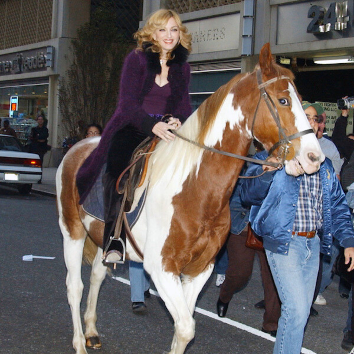 Madonna riding a horse in NYC, just two months after breaking nine bones falling off one