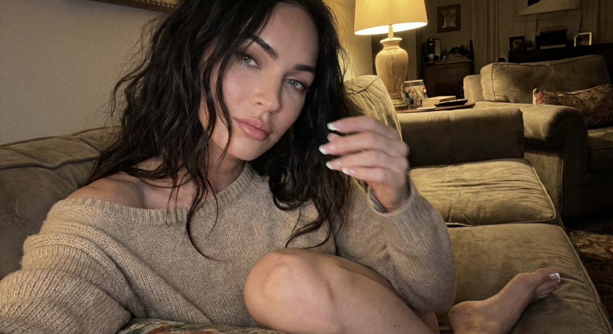 just sitting, come over.

Megan Fox

{
  "meta": {
    "camera": "iPhone 17 Pro (front camera)",
    "style": "warm indoor candid"
  },

  "scene": {
    "location": "living room couch",
    "time": "night"
  },

  "subject": {
    "identity": "Megan Fox",

    "pose": {