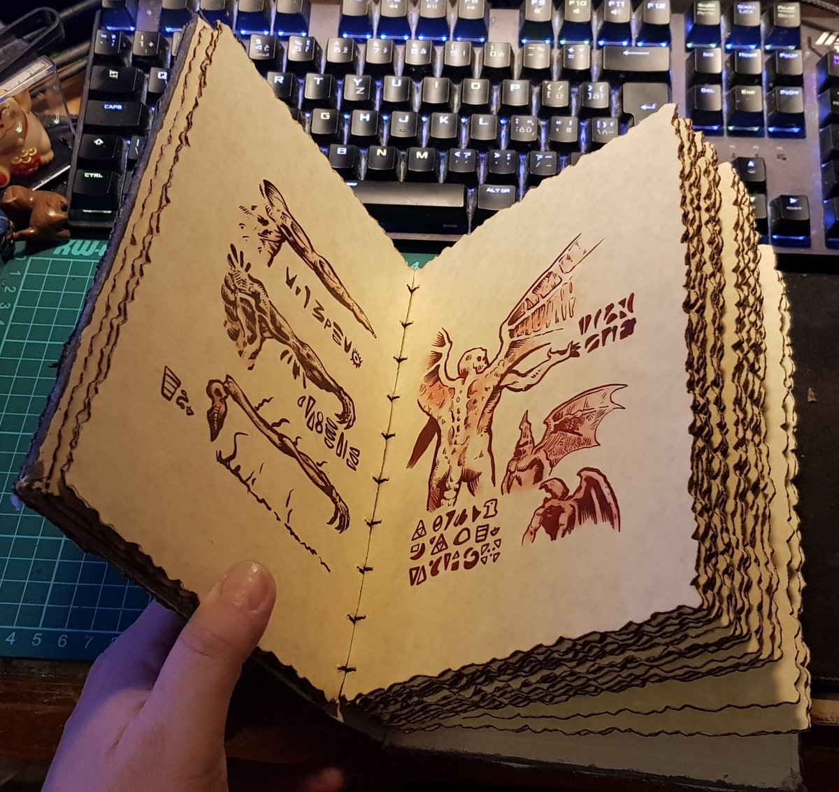 Sektan's tweet photo. I created my Necronomicon :) based on the movie Evil Dead 2. Many versions of the Necronomicon I've seen have the same problem, few pages in large boards or they had pages that shouldn't be there and weren't in the movie. My pages are 1mm. And all the pages are from the movie. https://t.co/eD1SZo8shc