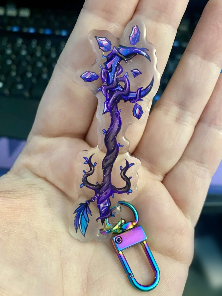 🌙 The Druid Keyblade keychains are here! These ones are extra fancy with domed glitter epoxy on the front to give it a little je ne sais quoi.

Where to buy:
 Etsy ► shivasenpai.etsy.com 
 Fourthwall ► shivasenpai-shop.fourthwall.com