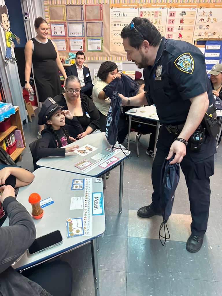 NYPD20Pct's tweet photo. Our 20th Precinct Youth Officers, PO Livingston &amp; PO Rodriguez, were guests at The Mickey Mantle School's "Mystery Reader Day" where they read to the kids, handed out gift bags, and swore them in as honorary police officers--badges and all! https://t.co/8GGLBlfM4b
