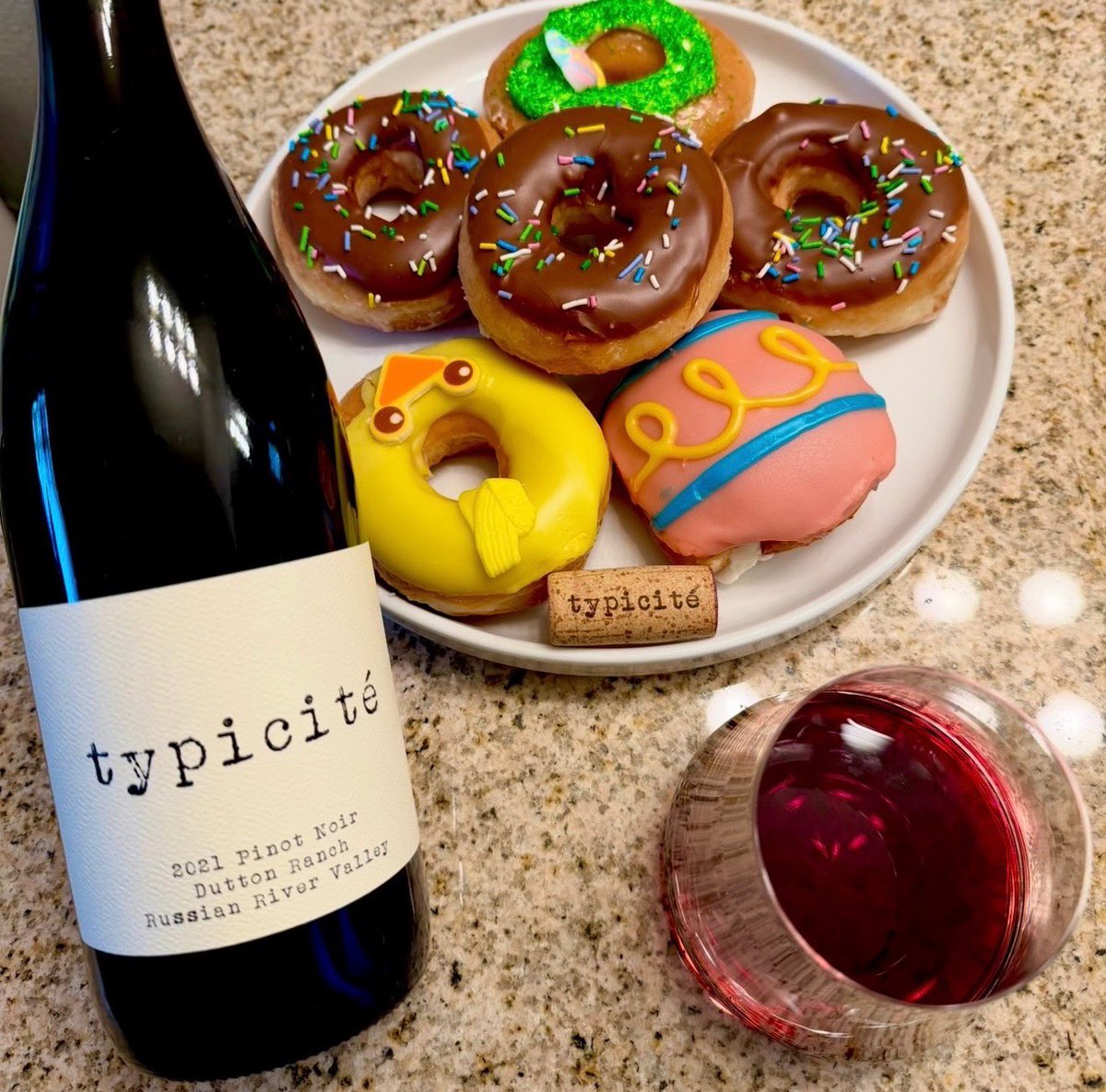 _drazzari's tweet image. #WineWednesday with Easter donuts from @krispykreme and a Typicite pinot noir from Dutton Ranch. There is a nose of black plum, rose petals and clove with tastes of black cherry, cinnamon and blood orange. Grab a donut as we get ready for Easter.